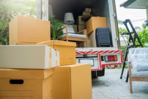 Boxes waiting to be moved into a new home,New home,Moving house day and real estate concept.