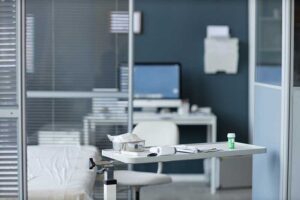 Background image of medical examination room with bed and tools in clinic, no people, copy space
